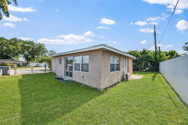 5720 SW 40th Ct, West Park, FL 33023 - rear view of house featuring stucco siding and central AC