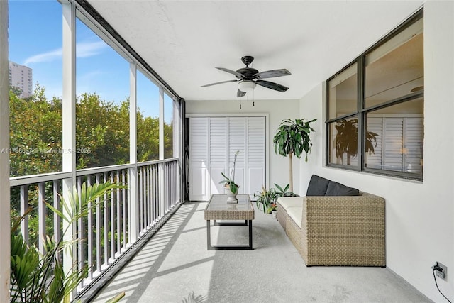 sunroom featuring a ceiling fan