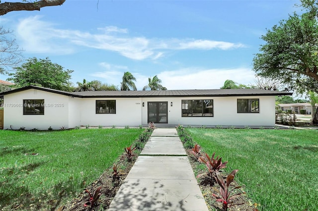 9494 SW 144th St, Miami, FL 33176 - view of front of home featuring stucco siding, a front yard, and french doors