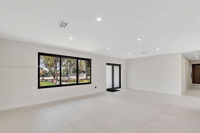 9494 SW 144th St, Miami, FL 33176 - empty room featuring recessed lighting, light tile patterned flooring, and baseboards