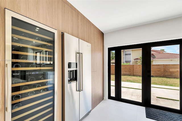 9494 SW 144th St, Miami, FL 33176 - doorway to outside with wine cooler and light tile patterned flooring