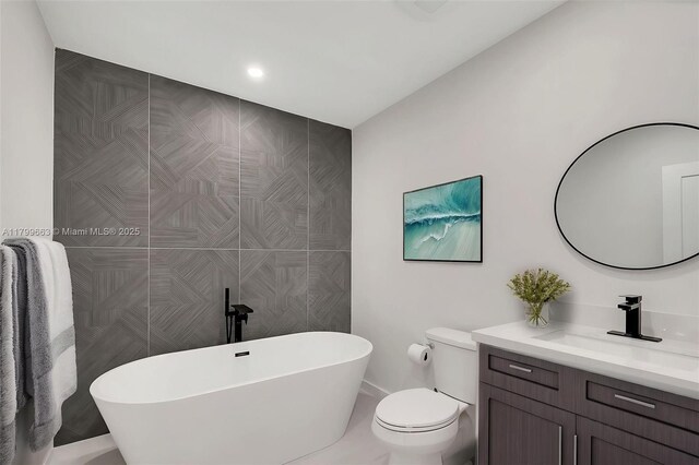 9494 SW 144th St, Miami, FL 33176 - bathroom featuring a soaking tub, toilet, and vanity