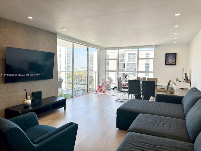 3731 N Country Club Dr Unit 2228, Aventura, FL 33180 - living room with wood finished floors, expansive windows, and recessed lighting