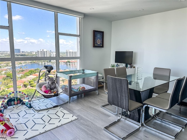 3731 N Country Club Dr Unit 2228, Aventura, FL 33180 - office with wood finished floors, a water view, recessed lighting, and a wall of windows