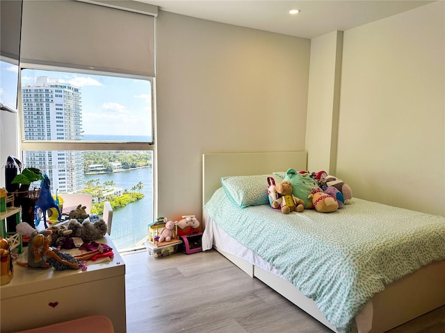 3731 N Country Club Dr Unit 2228, Aventura, FL 33180 - bedroom featuring wood finished floors, recessed lighting, a water view, and access to exterior