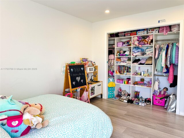 3731 N Country Club Dr Unit 2228, Aventura, FL 33180 - bedroom featuring wood finished floors, recessed lighting, and a closet
