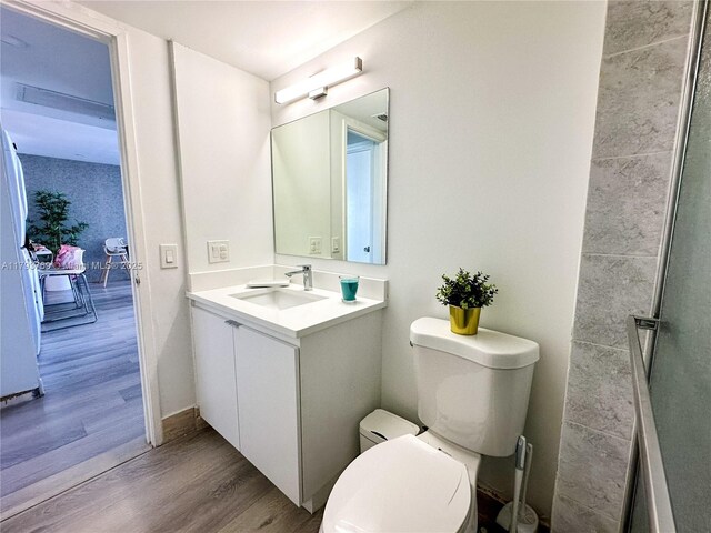 3731 N Country Club Dr Unit 2228, Aventura, FL 33180 - bathroom with toilet, wood finished floors, and vanity