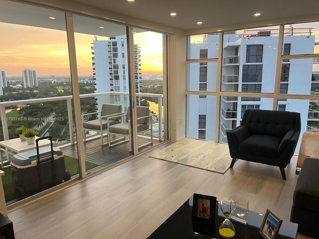 3731 N Country Club Dr Unit 2228, Aventura, FL 33180 - entryway featuring wood finished floors, a view of city, floor to ceiling windows, and recessed lighting