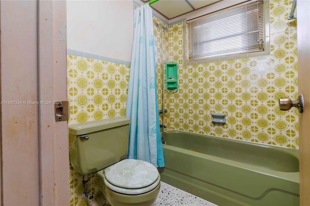 full bathroom featuring toilet and shower / bath combination with curtain