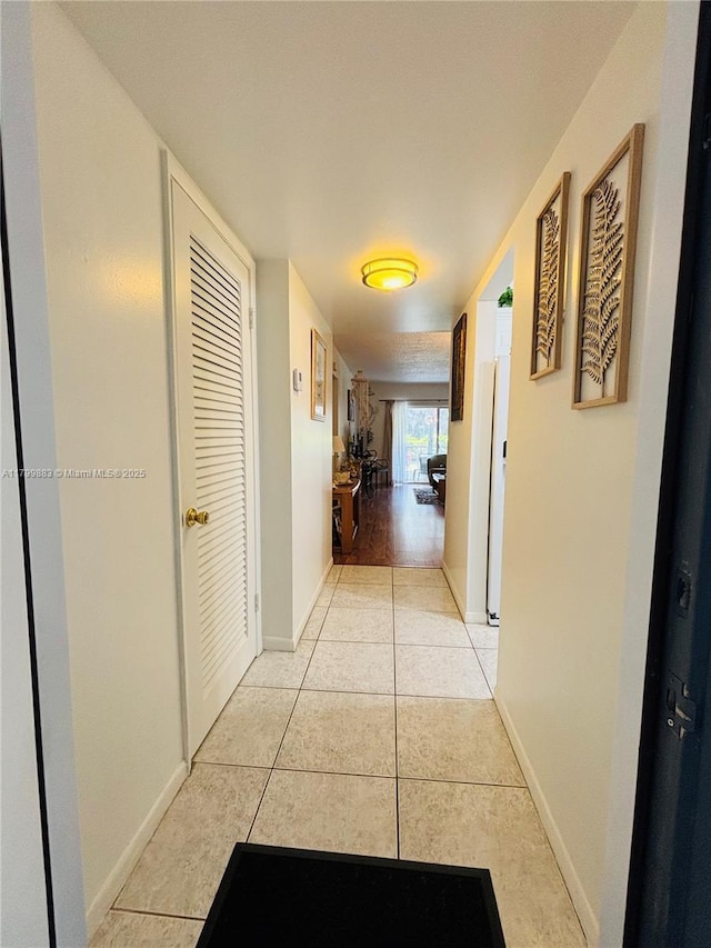 940 Hillcrest Ct Unit 112, Hollywood, FL 33021 - corridor with light tile patterned flooring and baseboards