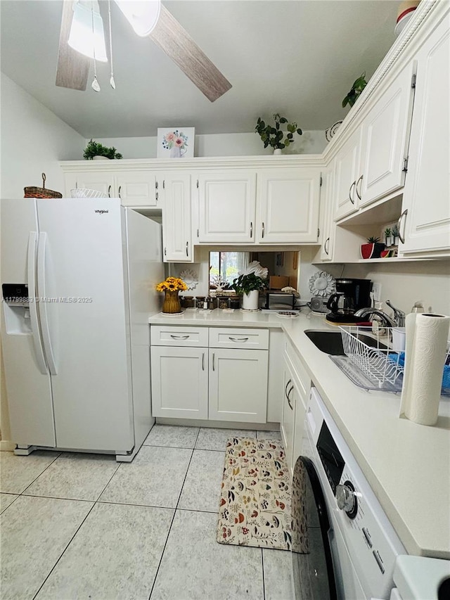 940 Hillcrest Ct Unit 112, Hollywood, FL 33021 - kitchen with white refrigerator with ice dispenser, white cabinetry, light tile patterned flooring, light countertops, and a ceiling fan