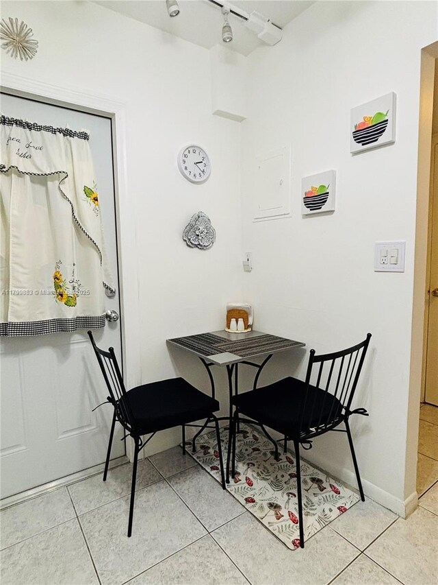 940 Hillcrest Ct Unit 112, Hollywood, FL 33021 - dining room with light tile patterned floors and track lighting