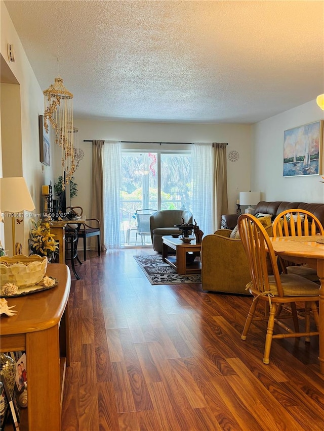 940 Hillcrest Ct Unit 112, Hollywood, FL 33021 - living area with a textured ceiling and dark wood-style flooring