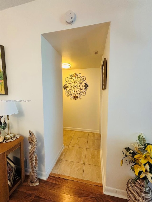 940 Hillcrest Ct Unit 112, Hollywood, FL 33021 - hallway with baseboards and light wood-style flooring
