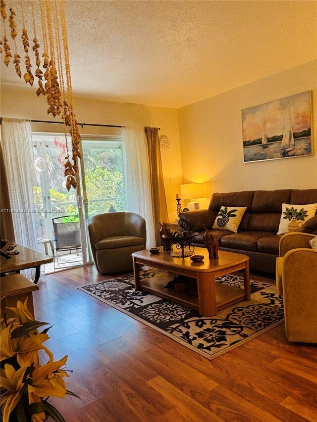 940 Hillcrest Ct Unit 112, Hollywood, FL 33021 - living room featuring wood finished floors and a textured ceiling
