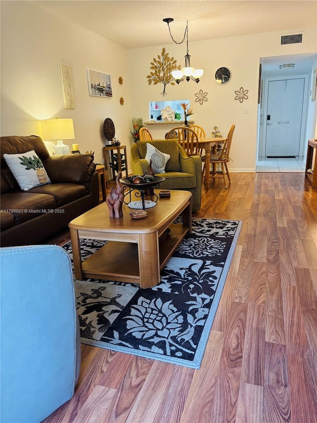 940 Hillcrest Ct Unit 112, Hollywood, FL 33021 - living area with wood finished floors and a chandelier