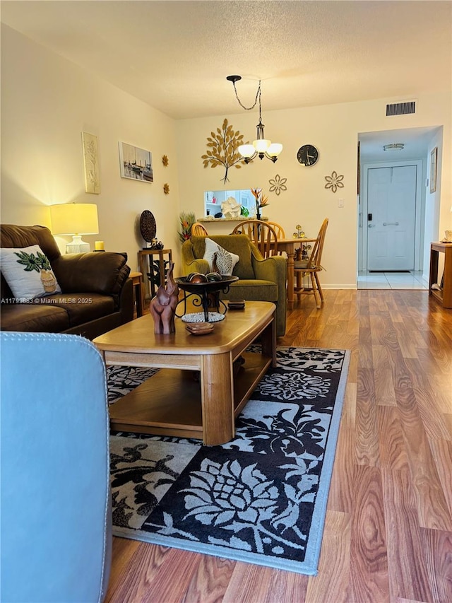 940 Hillcrest Ct Unit 112, Hollywood, FL 33021 - living area featuring wood finished floors and a chandelier