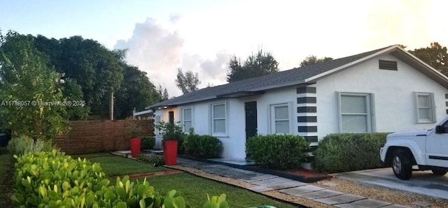 1291 NE 146th St, Miami, FL 33161 - view of side of property with stucco siding and fence