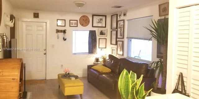 1291 NE 146th St, Miami, FL 33161 - living room with healthy amount of natural light and wood finished floors