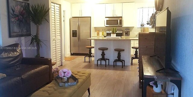 1291 NE 146th St, Miami, FL 33161 - living room featuring light wood-style floors