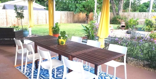 1291 NE 146th St, Miami, FL 33161 - view of patio featuring outdoor dining space