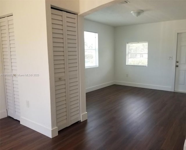 1291 NE 146th St, Miami, FL 33161 - unfurnished room with dark wood finished floors and baseboards