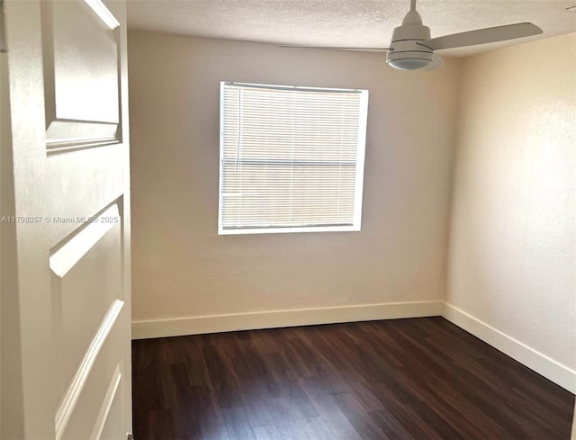1291 NE 146th St, Miami, FL 33161 - empty room featuring dark wood-style flooring, baseboards, ceiling fan, and a textured ceiling