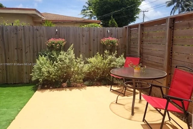 1291 NE 146th St, Miami, FL 33161 - view of patio featuring a fenced backyard