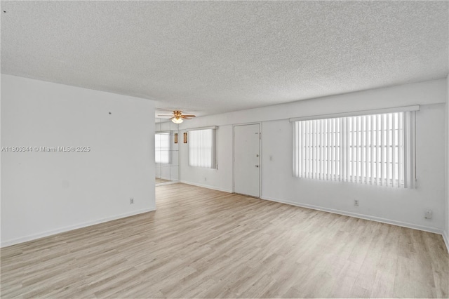 300 SW 134th Way Unit 413E, Pembroke Pines, FL 33027 - unfurnished living room featuring light wood finished floors, ceiling fan, a textured ceiling, and baseboards