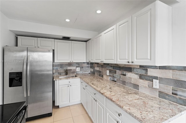 300 SW 134th Way Unit 413E, Pembroke Pines, FL 33027 - kitchen featuring stainless steel fridge with ice dispenser, a sink, white cabinets, and recessed lighting