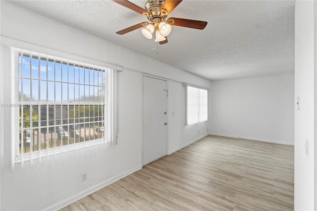 300 SW 134th Way Unit 413E, Pembroke Pines, FL 33027 - foyer featuring a textured ceiling, ceiling fan, wood finished floors, and baseboards
