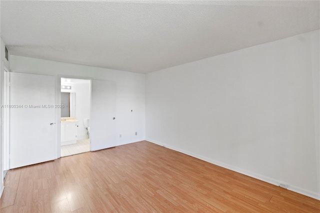 300 SW 134th Way Unit 413E, Pembroke Pines, FL 33027 - spare room featuring light wood-style flooring and baseboards