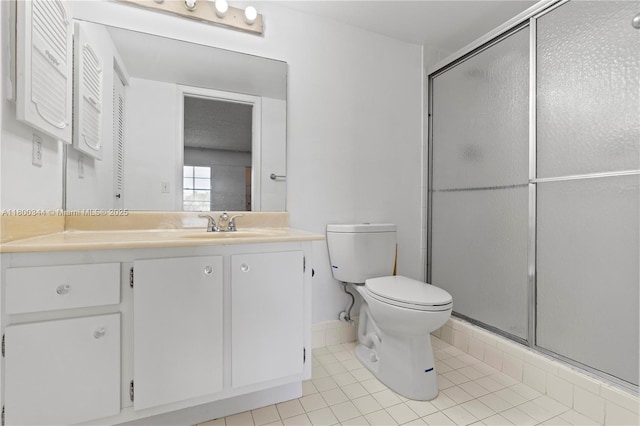 300 SW 134th Way Unit 413E, Pembroke Pines, FL 33027 - bathroom featuring tile patterned floors, a stall shower, toilet, and vanity
