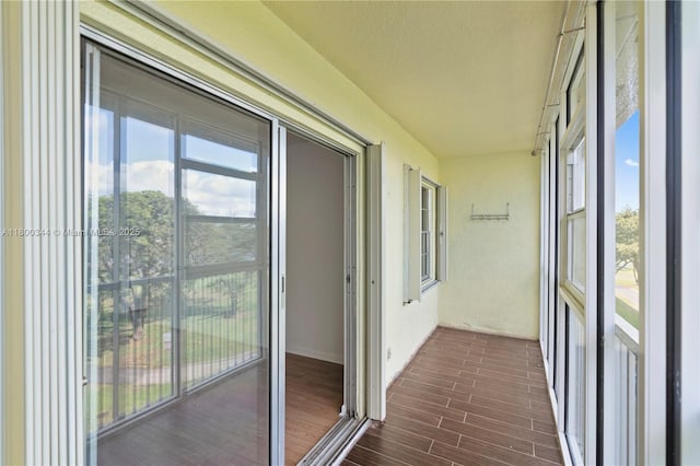 300 SW 134th Way Unit 413E, Pembroke Pines, FL 33027 - unfurnished sunroom featuring wood finished floors and a textured ceiling