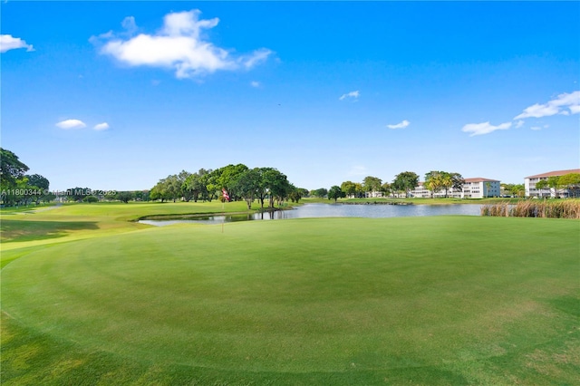 300 SW 134th Way Unit 413E, Pembroke Pines, FL 33027 - view of home's community with a water view, view of golf course, and a lawn