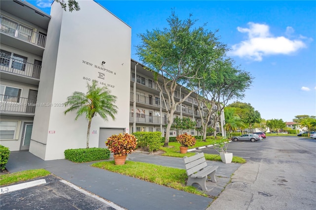 300 SW 134th Way Unit 413E, Pembroke Pines, FL 33027 - view of apartment building / complex featuring uncovered parking