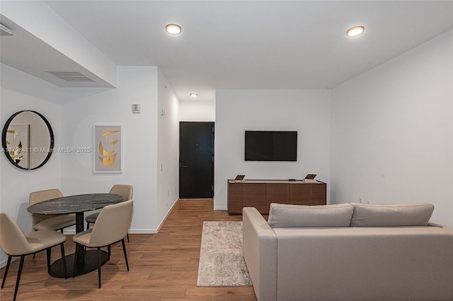 398 NE 5th St Unit 2415, Miami, FL 33132 - living room featuring light wood finished floors, baseboards, and recessed lighting