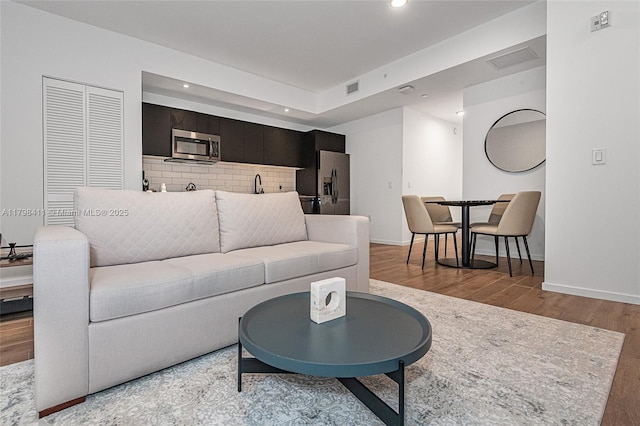 398 NE 5th St Unit 2415, Miami, FL 33132 - living room with recessed lighting, wood finished floors, and baseboards