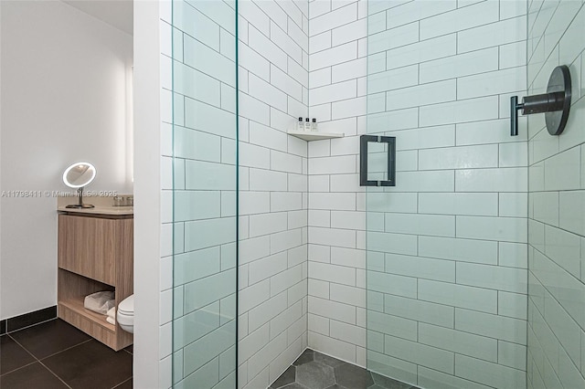 398 NE 5th St Unit 2415, Miami, FL 33132 - bathroom with a shower stall, toilet, and tile patterned floors