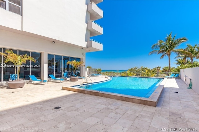 9225 Collins Ave Unit 307, Surfside, FL 33154 - community pool featuring a patio area and fence