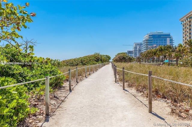 9225 Collins Ave Unit 307, Surfside, FL 33154 - view of community with fence and a city view