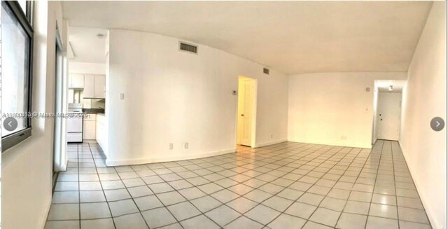 9225 Collins Ave Unit 307, Surfside, FL 33154 - spare room with light tile patterned floors
