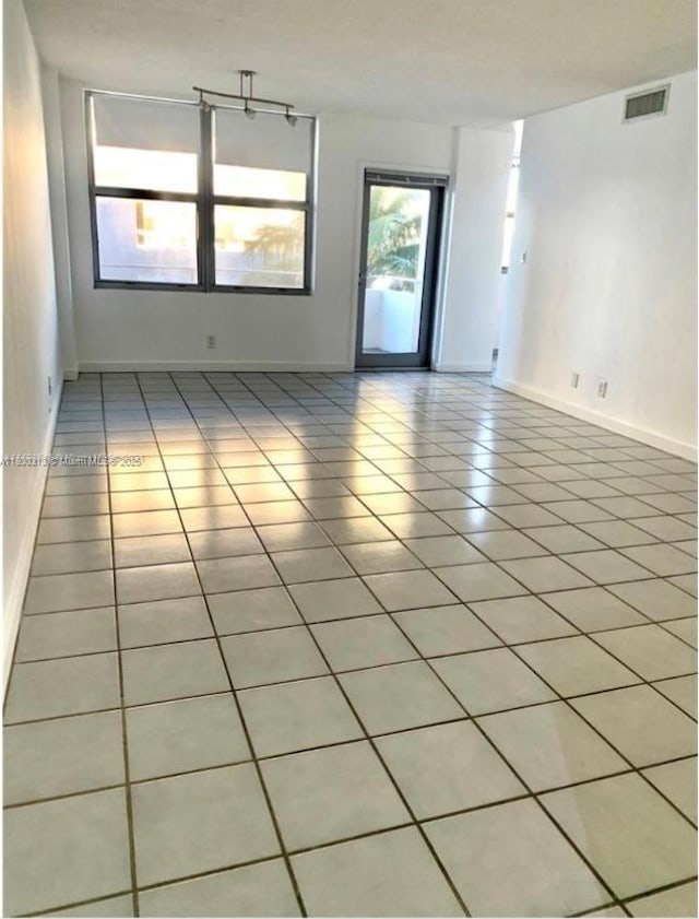 9225 Collins Ave Unit 307, Surfside, FL 33154 - unfurnished room with light tile patterned floors and baseboards