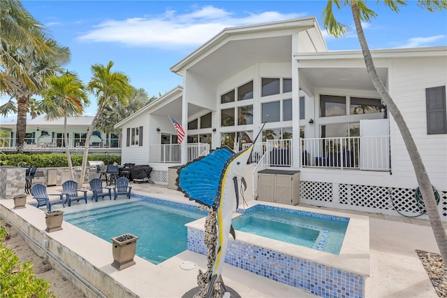 1220 Coury Dr, Key Colony, FL 33051 - back of property with an in-ground hot tub, an outdoor pool, and a patio