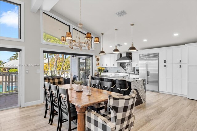 1220 Coury Dr, Key Colony, FL 33051 - dining space with light wood-style floors, recessed lighting, a chandelier, and baseboards