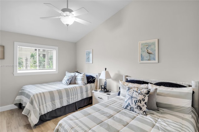 1220 Coury Dr, Key Colony, FL 33051 - bedroom with wood finished floors, baseboards, ceiling fan, and high vaulted ceiling
