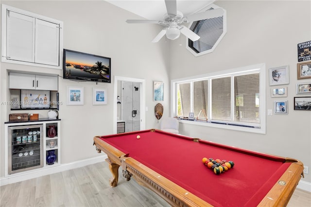 1220 Coury Dr, Key Colony, FL 33051 - game room with billiards table, a dry bar, light wood-type flooring, a high ceiling, and ceiling fan