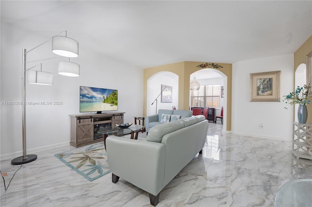 11324 NW 74th Ter, Doral, FL 33178 - living room featuring arched walkways, light marble finish flooring, and baseboards