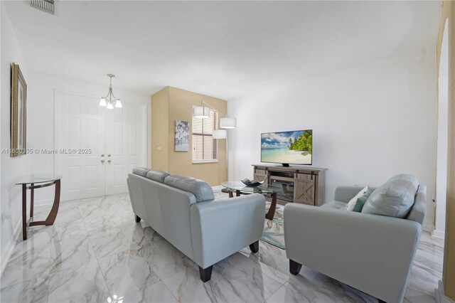 11324 NW 74th Ter, Doral, FL 33178 - living room with light marble finish floors and a chandelier