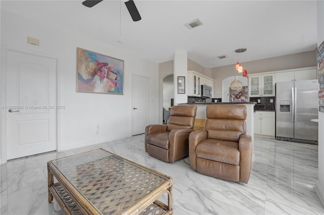 11324 NW 74th Ter, Doral, FL 33178 - living area with light marble finish floors, arched walkways, and a ceiling fan